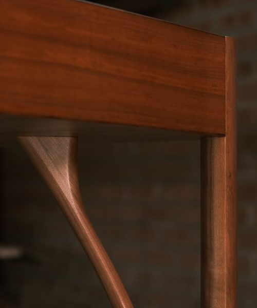 A beautiful Tasmanian myrtle and gidgee desk photographed in an Australian woodworking workshop.