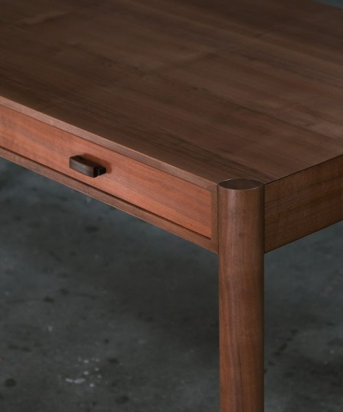 A beautiful Tasmanian myrtle and gidgee desk photographed in an Australian woodworking workshop.